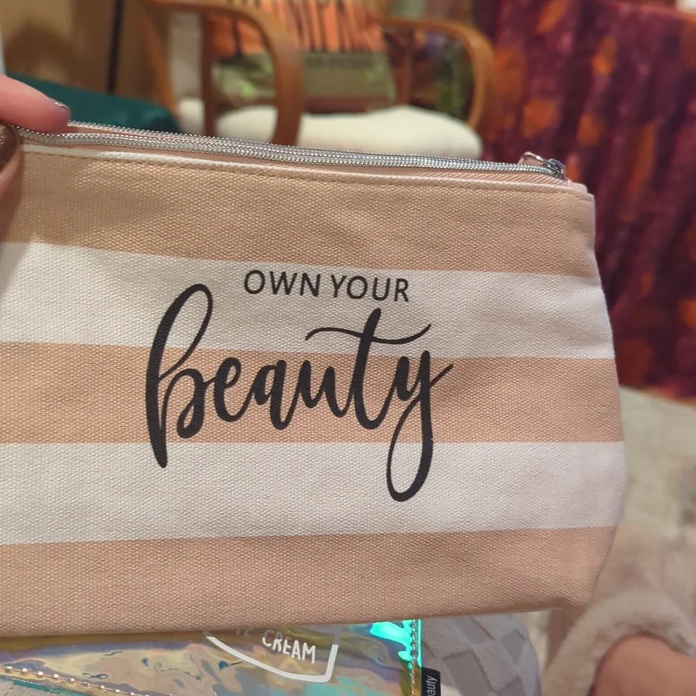 Cosmetic Bag Cases. Two. One Is Pink And White. One Is Shiny Pink.